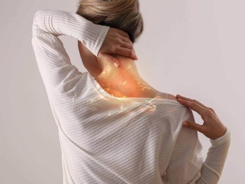 A woman in lubbock, tx struggles with neck pain and needs chiropractic neck pain treatment from dr. Brett chavez, d. C.
